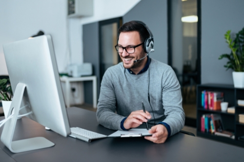 Managed By Bloom - A worker taking a phone call